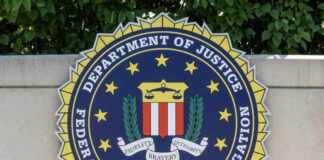 FBI seal featuring the Department of Justice emblem on a wall