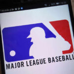 Major League Baseball logo displayed on a smartphone screen