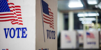 Voting booths with American flags in a polling station