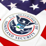 Department of Homeland Security seal on an American flag background