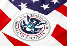 Department of Homeland Security seal on an American flag background