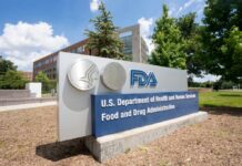 Sign for the U.S. Department of Health and Human Services Food and Drug Administration outside a building