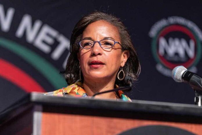 A woman speaking at a podium during a conference