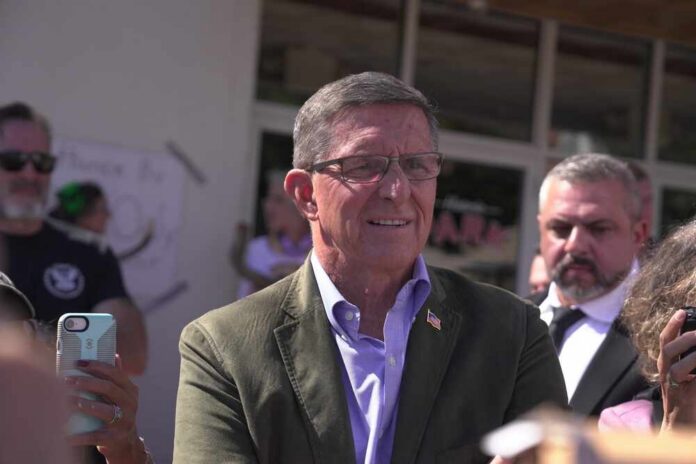 A man in a blazer interacting with a crowd during a public event