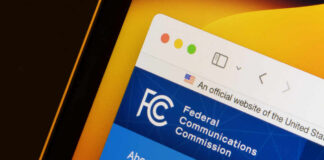 Close-up of the Federal Communications Commission website displayed on a screen