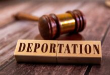 Wooden blocks spelling 'DEPORTATION' next to a gavel