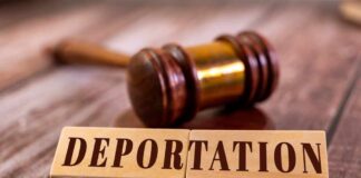 Wooden blocks spelling 'DEPORTATION' next to a gavel