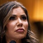 Trump Boots DHS Boss Over Lies Close-up portrait of a woman with a serious expression