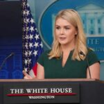 A woman speaking at a podium during a White House press briefing