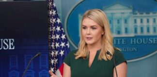 A woman speaking at a podium during a White House press briefing