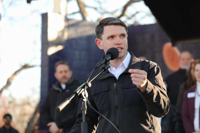 Individual speaking into a microphone at an outdoor event