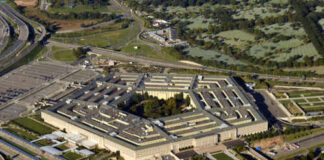 Aerial view of the Pentagon building surrounded by roads and greenery