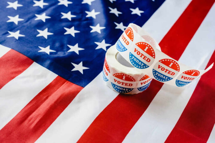 shutterstock_1314808097.jpg Voting stickers on an American flag background