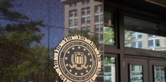 FBI seal displayed on the exterior of a government building