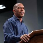 Congressman’s Explosive Attack on Trump’s Defense Chief A speaker delivering a presentation at a podium