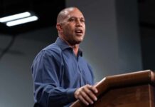 A speaker delivering a presentation at a podium