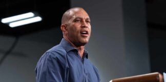 A speaker delivering a presentation at a podium