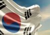 Waving flag of South Korea against a blue sky