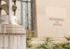 Exterior view of the Department of Justice building with decorative elements