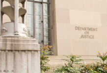 Exterior view of the Department of Justice building with decorative elements