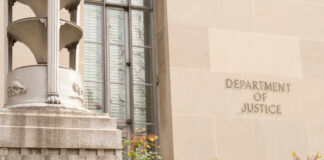 Exterior view of the Department of Justice building with decorative elements
