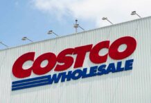 Sign of Costco Wholesale store against a blue sky