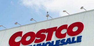 Sign of Costco Wholesale store against a blue sky