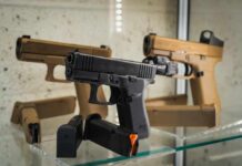 Display of handguns in a glass case