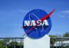 NASA logo displayed against a clear blue sky