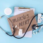 Medical supplies and a note indicating a measles alert