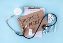 Medical supplies and a note indicating a measles alert