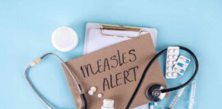 Medical supplies and a note indicating a measles alert