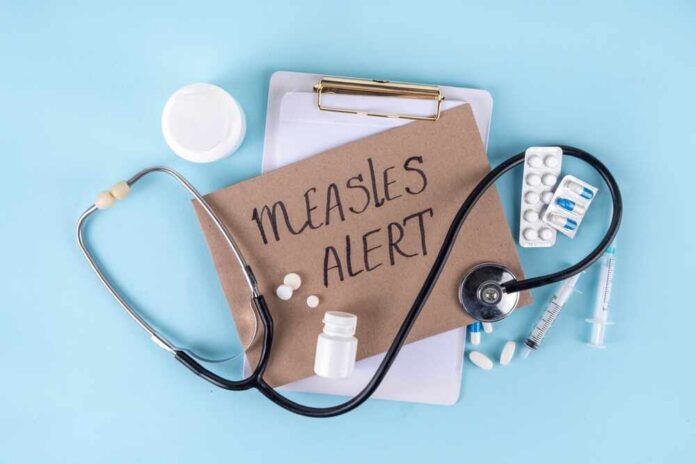 Medical supplies and a note indicating a measles alert