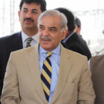 China, Pakistan, and Iran: The Quiet Power Alliance Group of men in formal attire engaged in conversation outdoors