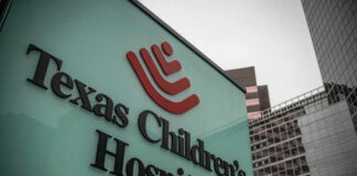 Texas Children's Hospital sign in front of modern buildings