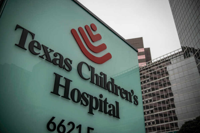 Texas Children's Hospital sign in front of modern buildings