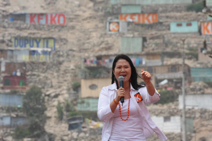 Lima,,Peru,-,December,07,,2010:,Candidate,For,The,Presidency woman speaking into a microphone at an outdoor event