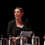 Privacy Threat ALERT: UK Scanning Phones Debate Explodes A woman speaking at a panel discussion with a focused expression