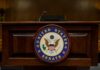 Senate SHOWDOWN: Warren’s Watchdog DEFEATED! Podium with the United States Senate seal in a formal setting