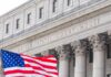 Immigration Judge’s Secret Termination Exposed Facade of a United States courthouse with an American flag in the foreground
