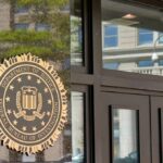 Secret Chinese Police Station Busted in NYC FBI seal displayed on the exterior of a government building