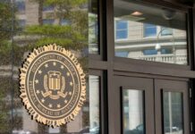 FBI seal displayed on the exterior of a government building