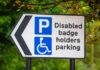 Fraudsters Exploit Disabled Parking Perks Disabled parking sign with left arrow