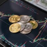 Various cryptocurrency coins on a digital trading chart
