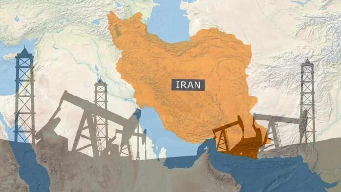 Conceptual,Map,Of,Iran,Overlaid,With,Silhouettes,Of,Oil,Pumpjacks Map of Iran highlighting oil production areas with oil rigs in the foreground