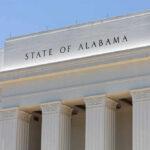 Supreme Court U-Turn Shocks Civil Rights Groups Facade of a government building with the words 'STATE OF ALABAMA' displayed prominently