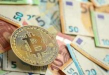 Fake Charity Funnels Cash To Hamas Bitcoin coin on scattered euro banknotes