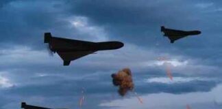 Three military drones fly through a cloudy sky amid anti-air fire