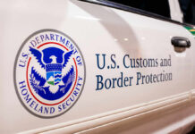 Senate Approves $70B Border Crackdown Close-up of U.S. Customs and Border Protection emblem on a vehicle