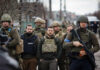 Shadow Drone Network Rattles Beijing A group of military personnel in tactical gear walking through an urban area